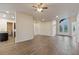 Open living area with tile floors, high ceilings, and access to kitchen and backyard at 1943 Sipes Ave, Sanford, FL 32771