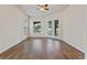 Spacious living room with tile floors and French doors leading to patio at 1943 Sipes Ave, Sanford, FL 32771