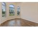 Bright office space with wood-look tile floors and arched windows at 1943 Sipes Ave, Sanford, FL 32771