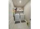 Laundry room with washer, dryer, and shelving at 261 Primrose Dr, Davenport, FL 33837