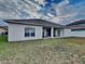 Large backyard with patio and grassy area at 2739 Star Grass Cir, Kissimmee, FL 34746