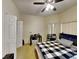 Bright bedroom featuring a ceiling fan and ample closet space at 2739 Star Grass Cir, Kissimmee, FL 34746