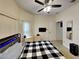 Comfortable bedroom with a ceiling fan and plenty of natural light at 2739 Star Grass Cir, Kissimmee, FL 34746