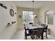 Dining room with six-chair table and decorative wall accents at 2739 Star Grass Cir, Kissimmee, FL 34746