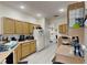 Kitchen with wood cabinets, stainless steel appliances, and double sink at 2739 Star Grass Cir, Kissimmee, FL 34746
