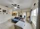 Living area with sectional sofa and view into kitchen and dining area at 2739 Star Grass Cir, Kissimmee, FL 34746