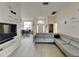 Spacious living room featuring a large sectional sofa and flat-screen TV at 2739 Star Grass Cir, Kissimmee, FL 34746
