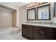 Clean bathroom with double vanity, granite countertop, and tiled flooring at 3251 Brewster Dr, Kissimmee, FL 34743