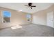 Bright bedroom with vaulted ceiling, carpet flooring, and multiple windows at 3251 Brewster Dr, Kissimmee, FL 34743