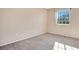 Bedroom with window, neutral walls, and carpet flooring at 3251 Brewster Dr, Kissimmee, FL 34743
