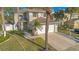 Two-story house with a white garage door and stone accents at 3251 Brewster Dr, Kissimmee, FL 34743