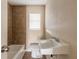 Clean bathroom with a tiled shower and white sink at 421 Jefferson St, Daytona Beach, FL 32114