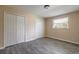 Bright bedroom with wood-look floors and double closets at 421 Jefferson St, Daytona Beach, FL 32114
