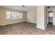 Living room with wood-like floors, neutral walls and view to bathroom at 421 Jefferson St, Daytona Beach, FL 32114