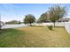 Large backyard with fenced in area and lush grass at 4847 Havilland Dr, Mount Dora, FL 32757
