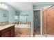 Bathroom features a walk-in shower and double vanity at 4847 Havilland Dr, Mount Dora, FL 32757