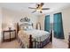 Bedroom with a full-size bed, nightstand and window at 4847 Havilland Dr, Mount Dora, FL 32757