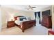 Well-lit bedroom with a double bed, nightstand and dresser at 4847 Havilland Dr, Mount Dora, FL 32757