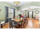Formal dining room with hardwood floors and a view of the living room at 4847 Havilland Dr, Mount Dora, FL 32757