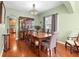 Formal dining room with hardwood floors and a view of the kitchen at 4847 Havilland Dr, Mount Dora, FL 32757