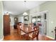 Dining room with hardwood floors and access to a patio at 4847 Havilland Dr, Mount Dora, FL 32757