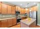 Modern kitchen with stainless steel appliances and granite countertops at 4847 Havilland Dr, Mount Dora, FL 32757