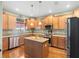 Modern kitchen with stainless steel appliances and an island at 4847 Havilland Dr, Mount Dora, FL 32757