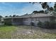 Home's backyard with grassy area and partial fence at 5803 Clearview Dr, Orlando, FL 32819