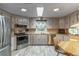 Bright kitchen featuring stainless steel appliances, wood countertops, and a window that brings in natural light at 598 E Club Blvd, Lake Mary, FL 32746