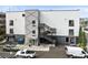 Modern building exterior with parking and multiple entrances at 62 W Colonial Dr # 205, Orlando, FL 32801