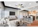 Open living area featuring hardwood floors and a stylish media console at 62 W Colonial Dr # 205, Orlando, FL 32801