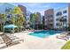 Resort-style pool with lounge chairs and shaded cabanas at 62 W Colonial Dr # 205, Orlando, FL 32801