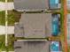 Aerial view of house with pool and surrounding homes at 8106 Fan Palm Way, Kissimmee, FL 34747