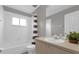 Clean bathroom with tub shower, vanity, and tile flooring at 8106 Fan Palm Way, Kissimmee, FL 34747
