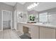 Double vanity bathroom with walk-in closet at 8106 Fan Palm Way, Kissimmee, FL 34747
