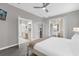 Main bedroom with access to bathroom and private patio at 8106 Fan Palm Way, Kissimmee, FL 34747
