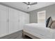 Spacious bedroom with large closet and wood-look floors at 8106 Fan Palm Way, Kissimmee, FL 34747