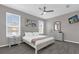 Main bedroom with king-size bed and gray walls at 8106 Fan Palm Way, Kissimmee, FL 34747