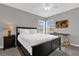 Bedroom with a desk and wood-look floors at 8106 Fan Palm Way, Kissimmee, FL 34747