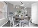 Cozy dining area with a rustic table and four chairs at 8106 Fan Palm Way, Kissimmee, FL 34747