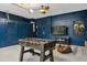 Fun game room, foosball table, and beanbag chairs at 8106 Fan Palm Way, Kissimmee, FL 34747
