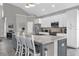 Kitchen island with granite countertop and seating for four at 8106 Fan Palm Way, Kissimmee, FL 34747