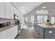 Modern kitchen with white cabinets, granite counters, and herringbone backsplash at 8106 Fan Palm Way, Kissimmee, FL 34747
