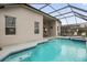 Enjoy this screened pool and spa at 8106 Fan Palm Way, Kissimmee, FL 34747
