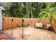 Relaxing backyard patio with seating area and wooden fence at 844 Sugar House Dr, Port Orange, FL 32129