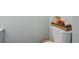 Clean bathroom with a toilet and wicker basket at 844 Sugar House Dr, Port Orange, FL 32129