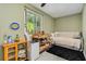 Small bonus room with daybed and window at 844 Sugar House Dr, Port Orange, FL 32129