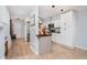 Modern kitchen with white cabinets, butcher block counters, and stainless steel appliances at 844 Sugar House Dr, Port Orange, FL 32129
