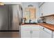 Modern kitchen with stainless steel appliances and wood countertops at 844 Sugar House Dr, Port Orange, FL 32129