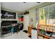 Multi-purpose room with desk, crib, and backyard access at 844 Sugar House Dr, Port Orange, FL 32129